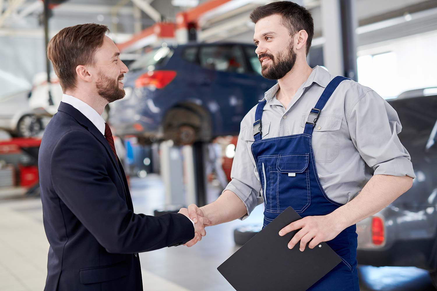 Mechanic Shaking Hands With Businessman Small.jpg