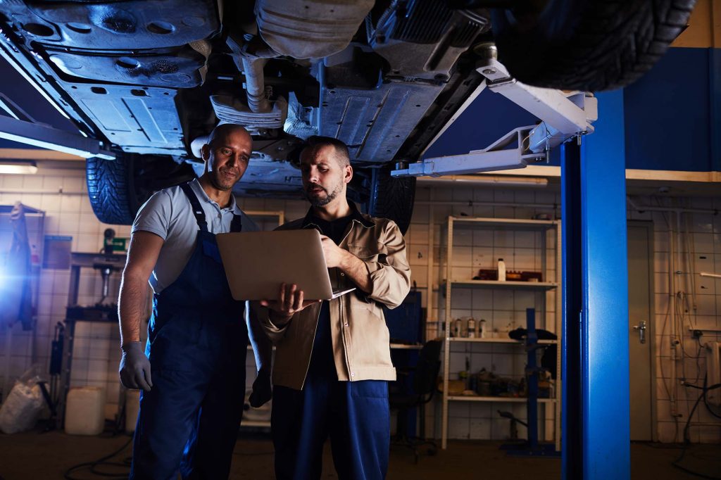 Mechanics Inspecting Car Small 1.jpg